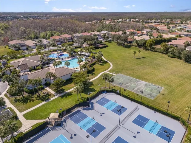 Drone / aerial view of the tennis/pickle-ball courts and basketball court.