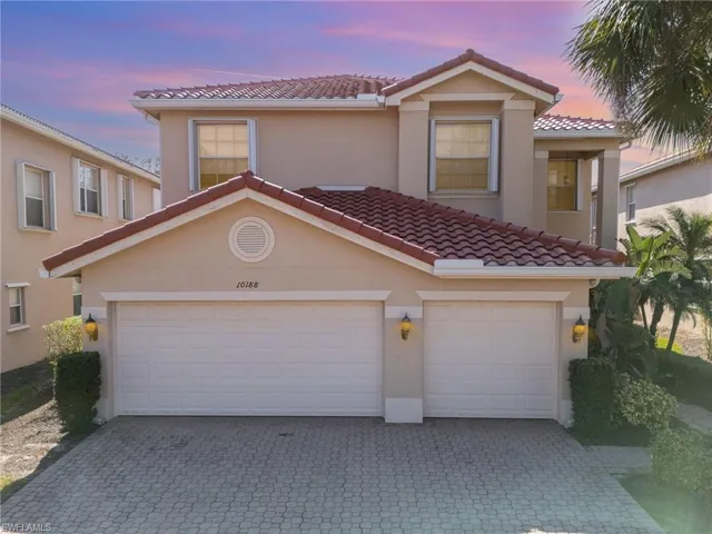 Mediterranean / Spanish home featuring a 3 car garage.