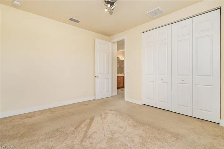 Bedroom # 5, features walk in closet and unobstructed view to the community amenities.