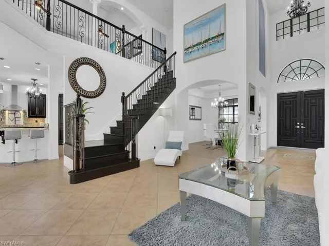 Tiled entrance foyer featuring a high ceiling