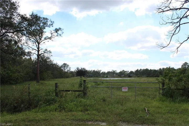 View of yard with a rural view