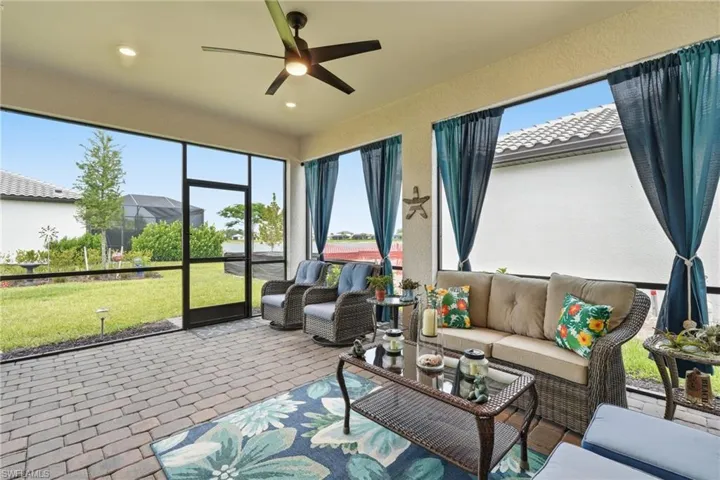 Screened outdoor patio featuring paver flooring