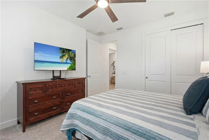 White walls and gray carpeting create a neutral palette