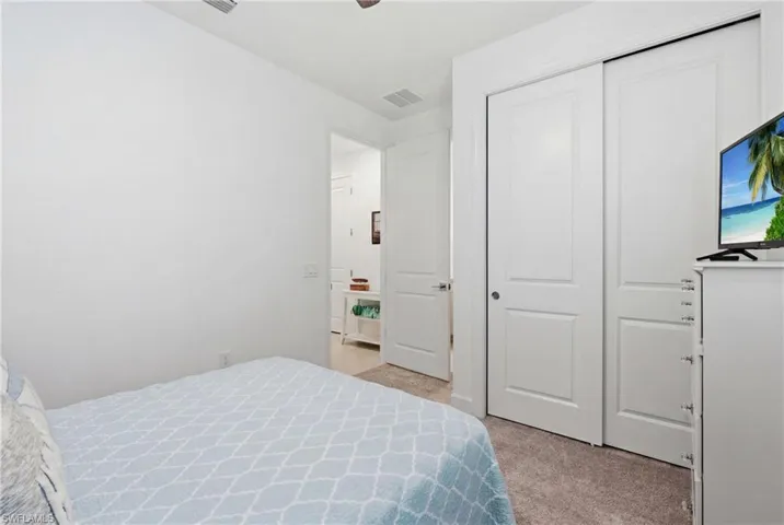 Plush carpet flooring complements bright white walls