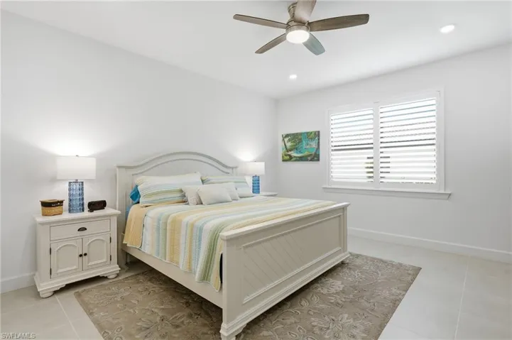 White-painted walls and light-colored tile flooring