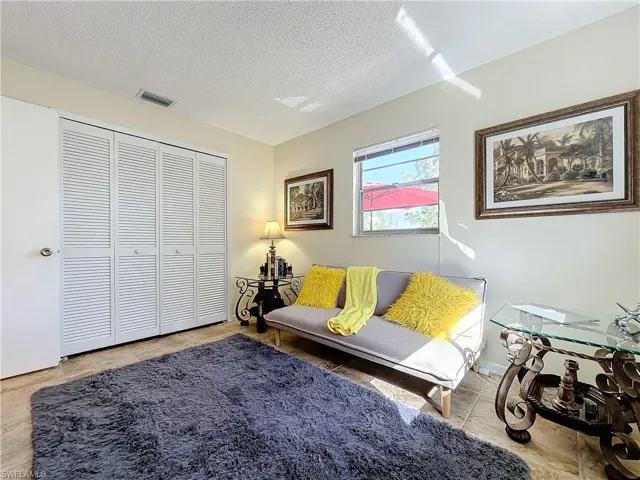 Living room featuring a textured ceiling