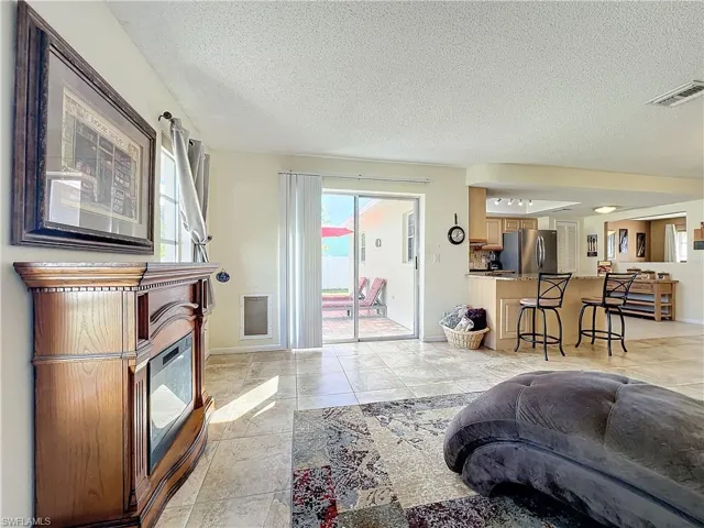 Living room featuring a textured ceiling