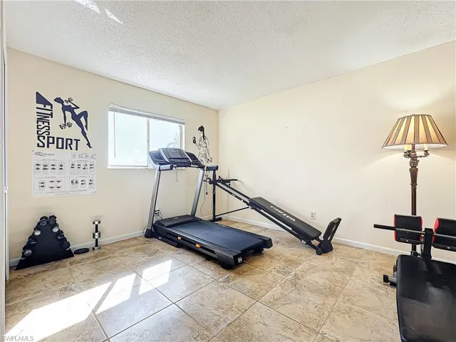 Workout area with a textured ceiling