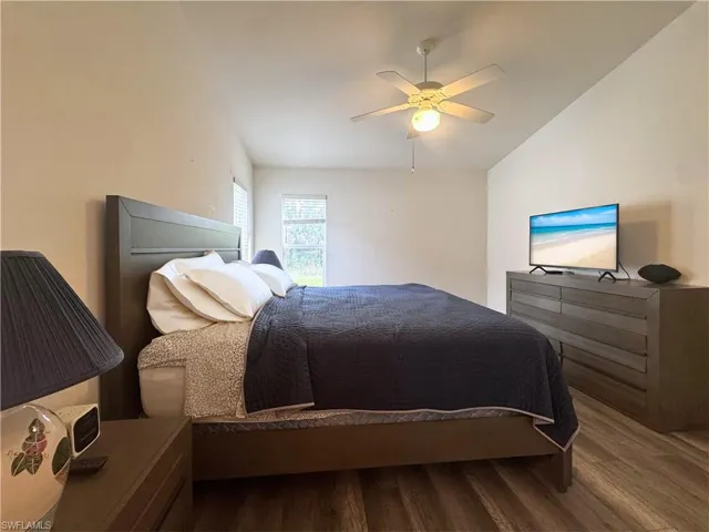 Bedroom featuring wood finished floors and ceiling fan