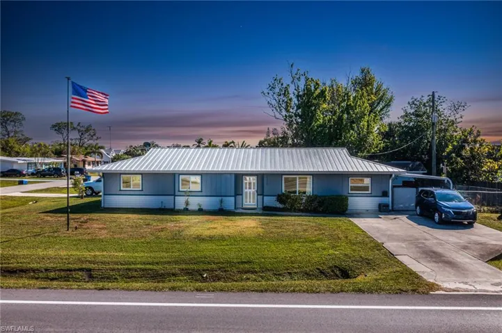 Ranch-style home with a yard