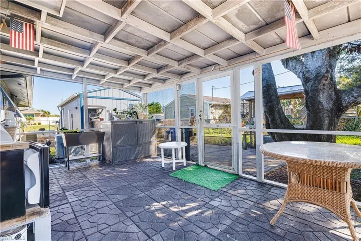 Sunroom featuring coffered ceiling