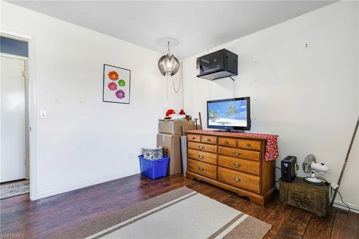Bedroom featuring dark hardwood / wood-style floors