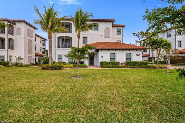 Mediterranean / spanish home featuring a front lawn
