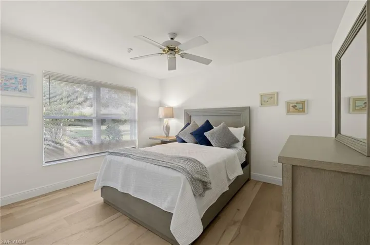 Bedroom featuring light hardwood / wood-style flooring and ceiling fan