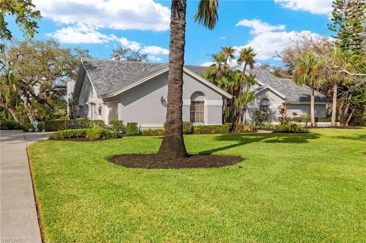 View of front of property with a front lawn