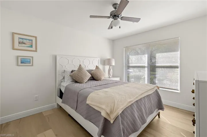 Bedroom with light wood-type flooring and ceiling fan