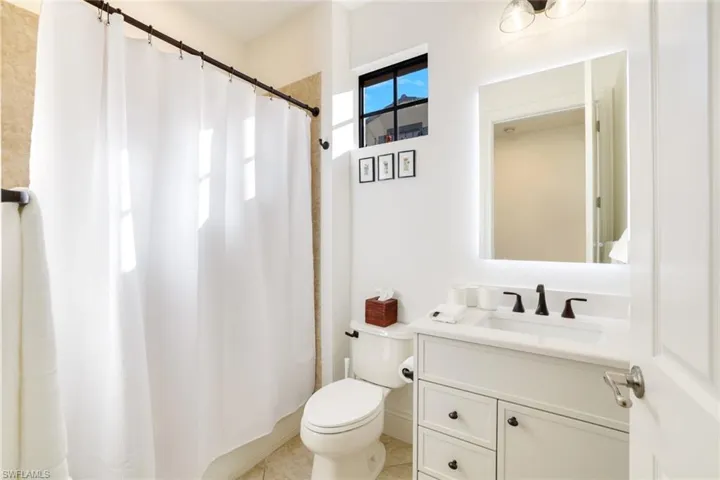 Bathroom featuring vanity and a shower with curtain