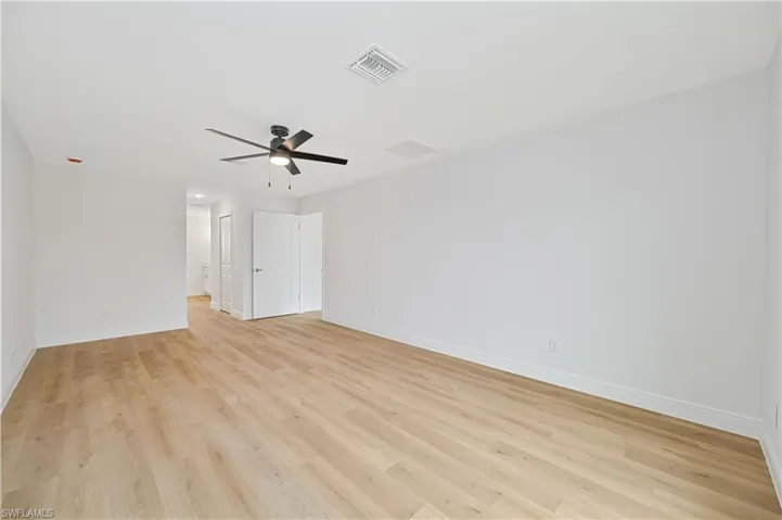 Spare room with light wood-style floors and ceiling fan