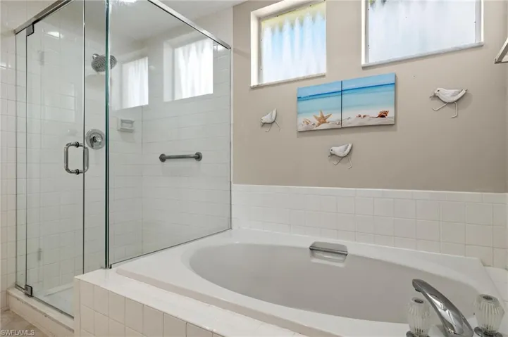 Bathroom featuring plus walk in shower