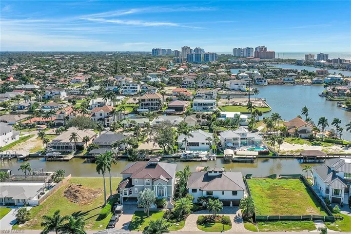 Aerial view of residential area with a nearby body of water