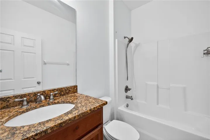 Full bathroom featuring vanity and  shower combination