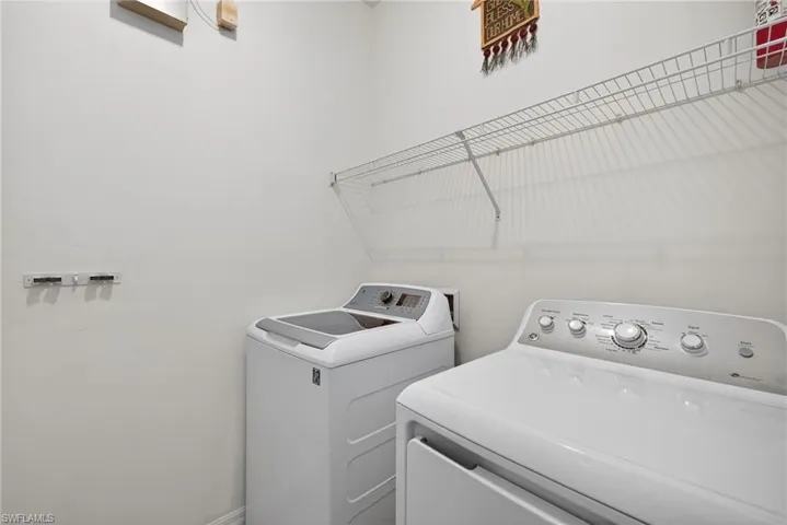 Laundry room featuring washing machine and dryer