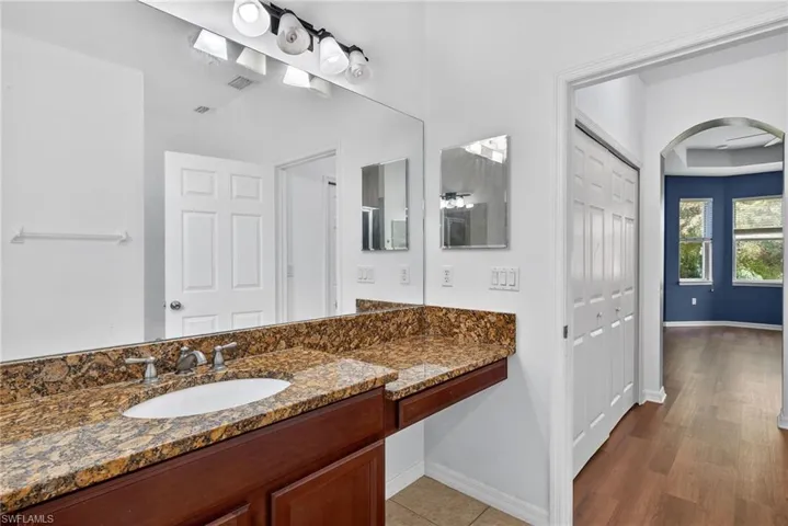 Bathroom with vanity and light wood-style floors