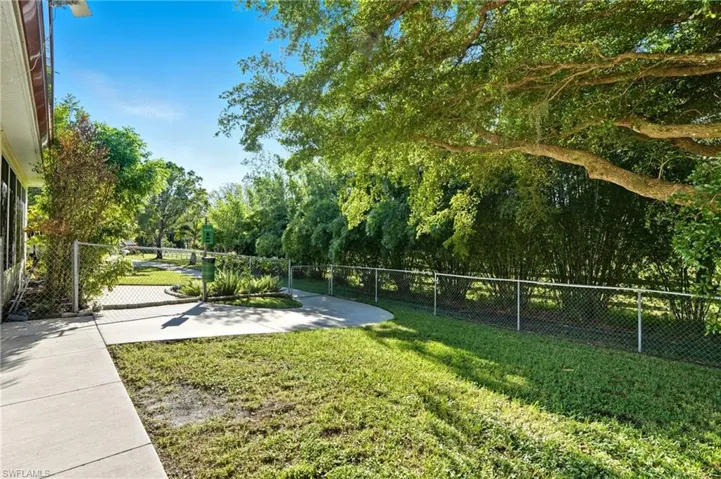 View of property's community featuring view of scattered trees