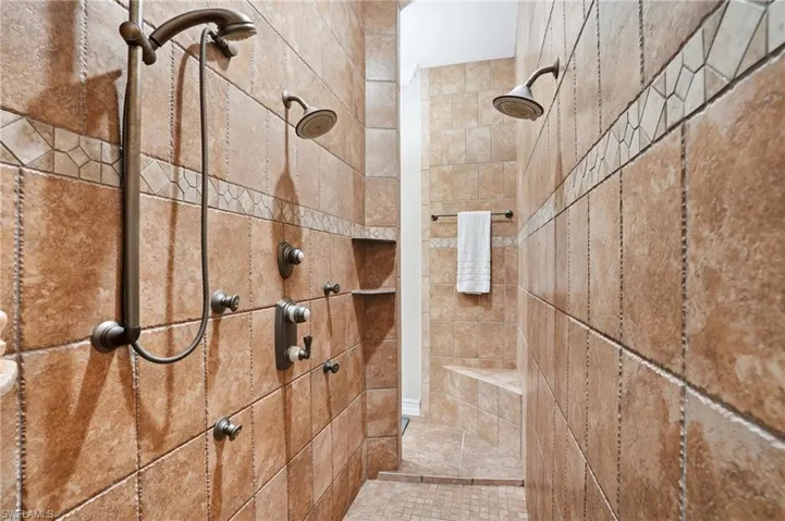 Full bath with a tile shower