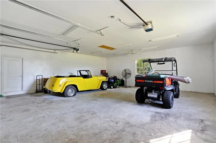 Garage featuring a garage door opener
