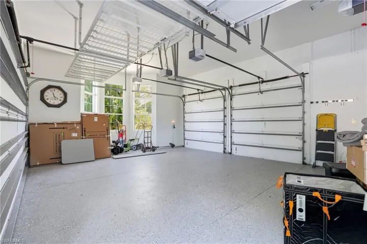 Garage featuring a garage door opener