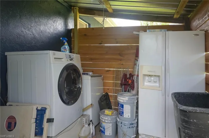 Clothes washing area with washer / clothes dryer