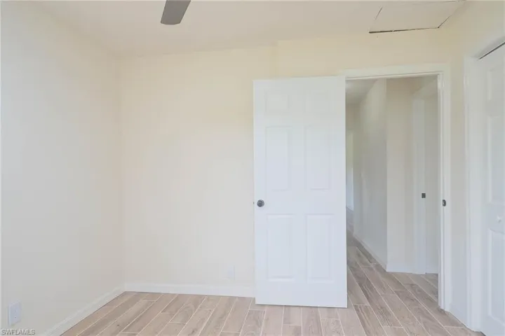 Unfurnished room featuring light hardwood / wood-style flooring and ceiling fan
