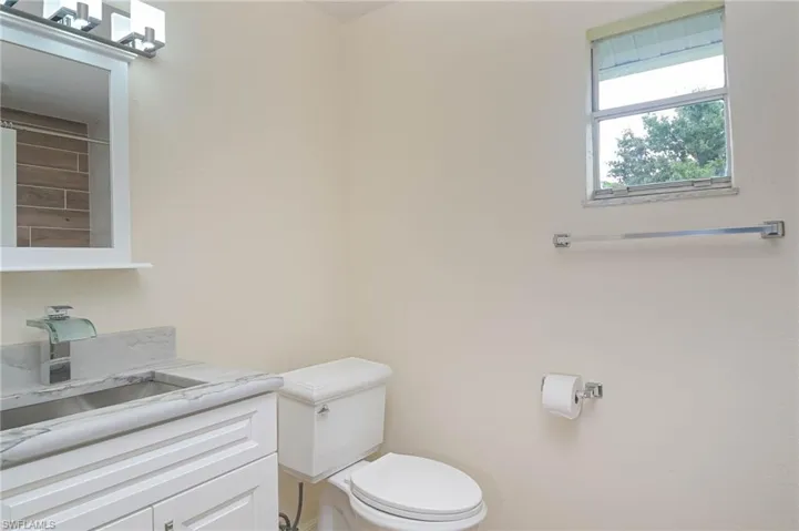 Bathroom with vanity and toilet