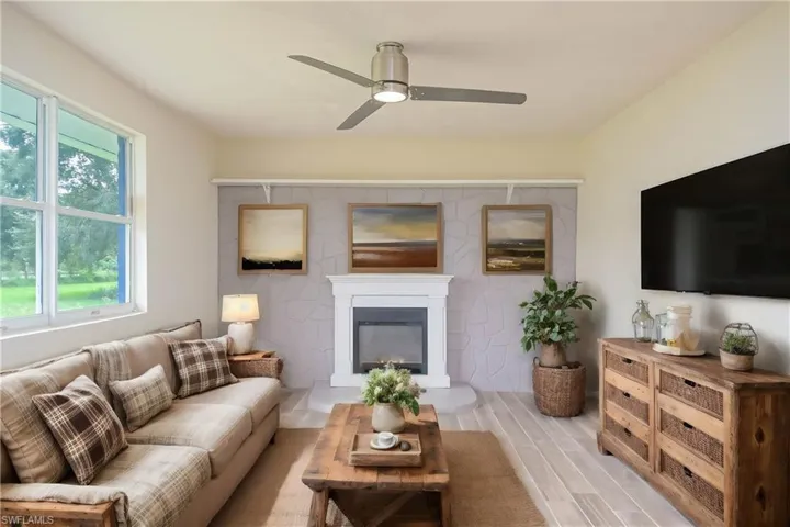 Photo includes reality renovation and/or staging to showcase the possibility of the Living Room. Design services included with purchase!