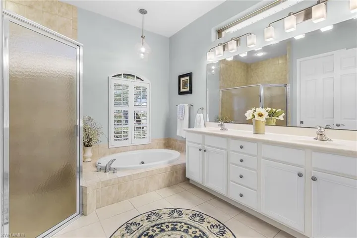 Double sinks, jetted tub and walk in shower