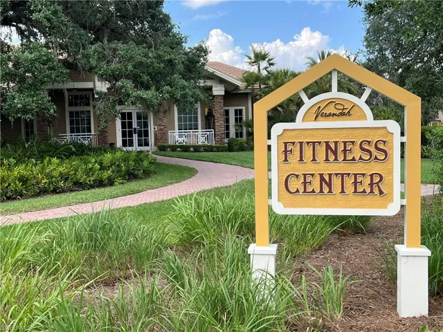 Fitness Center with Resort Pool Behind along with Tennis Courts, Bocce Ball and Pickle Ball courts