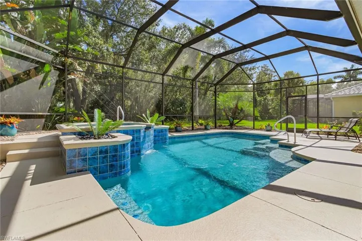 View covered seating area toward spa and pool