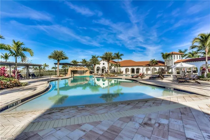 Community pool with a patio and a pergola