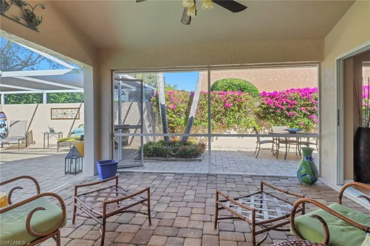 Sunroom / solarium featuring ceiling fan
