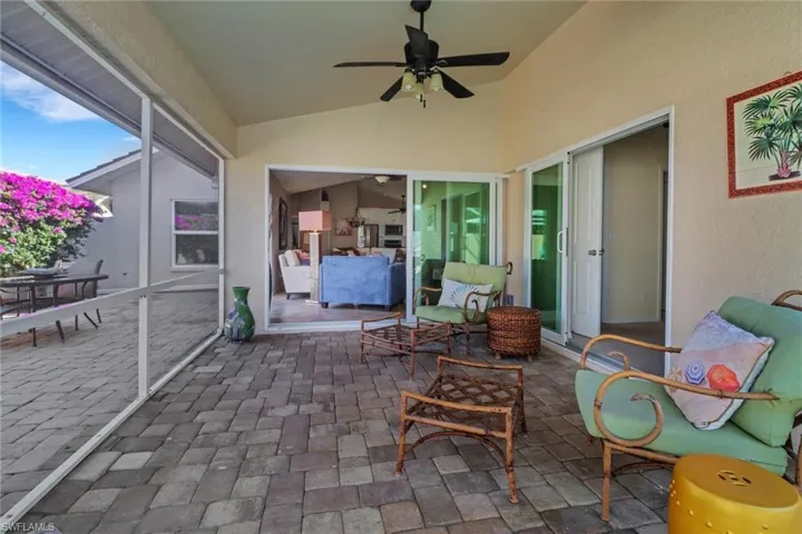 Sunroom with lofted ceiling and ceiling fan