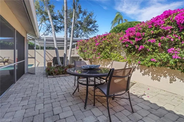View of patio with a lanai