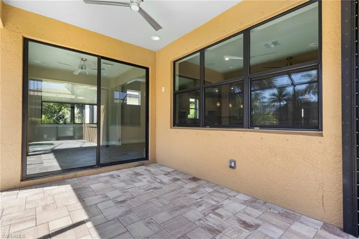 View of patio featuring ceiling fan