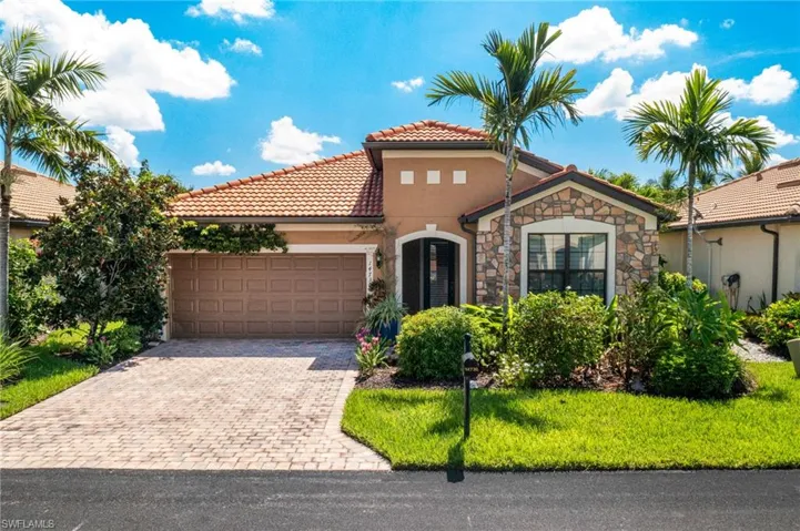 Mediterranean / spanish-style house featuring a garage