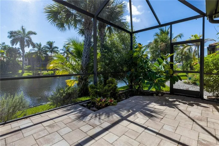 Unfurnished sunroom with a water view