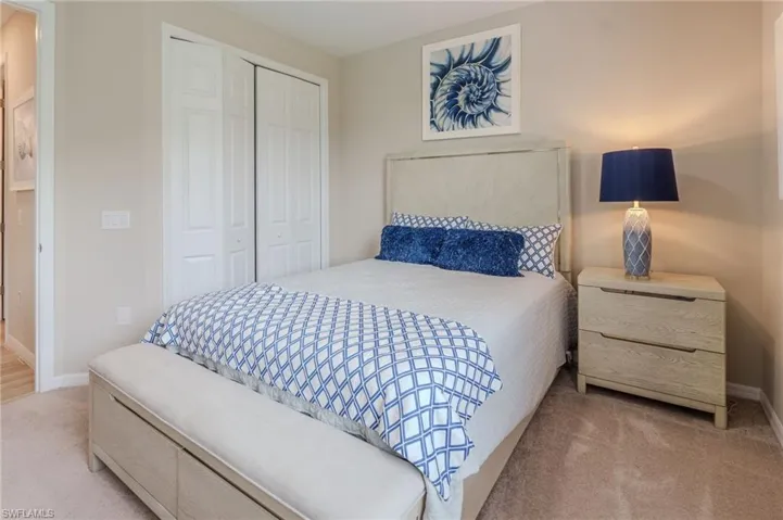 Plush carpeting complements the neutral wall tones