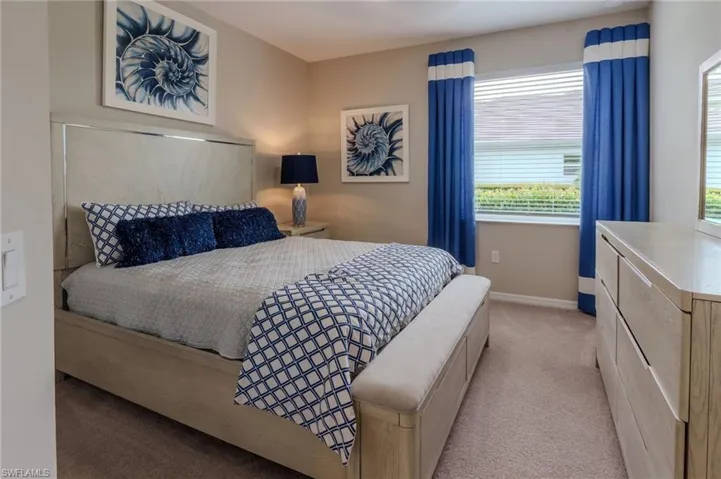 Bedroom featuring neutral wall paint and plush carpet flooring