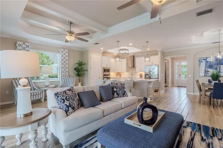 Open concept living space featuring wood-finish flooring
