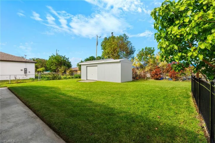 View of back yard with shed