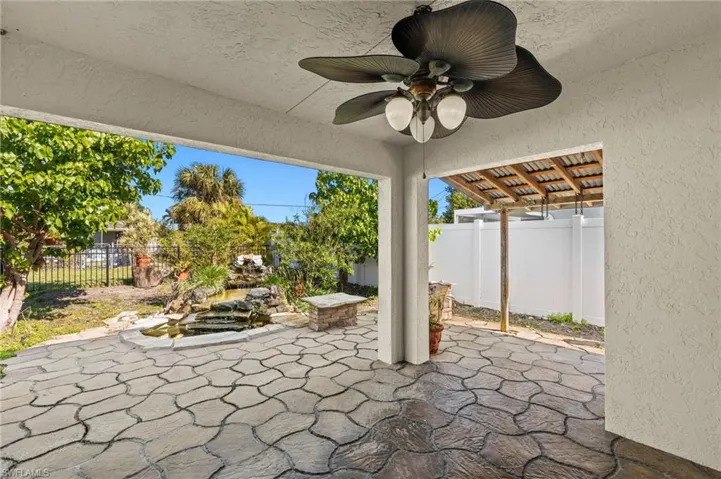 View of patio featuring ceiling fan